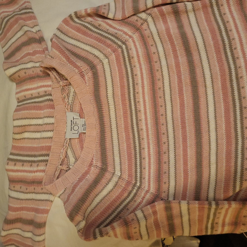 A sweater or top? Has a scarf attached.
